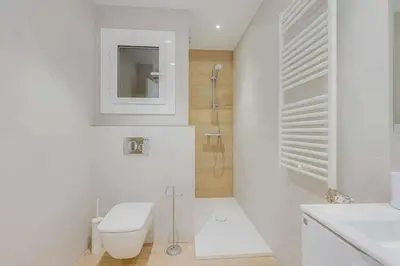Un baño de Apartamento Condal