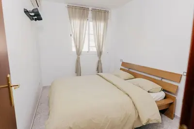 Cama o camas de una habitación en 2 Bedroom Apartment Lloret de Mar Terrace & Pool