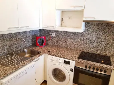 Una cocina o zona de cocina en Maravilloso piso con piscina a 200m de la playa