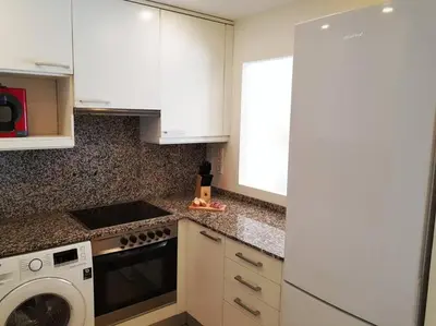 Una cocina o zona de cocina en Maravilloso piso con piscina a 200m de la playa