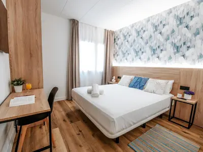 Cama o camas de una habitación en Sweet Lloret Suites - Smart Hotel