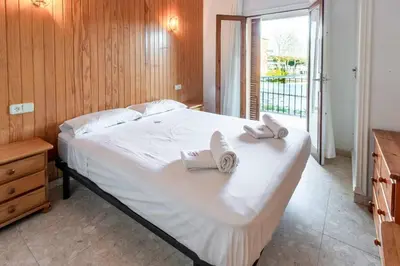 Cama o camas de una habitación en Isard 7 Apartamento junto a la playa