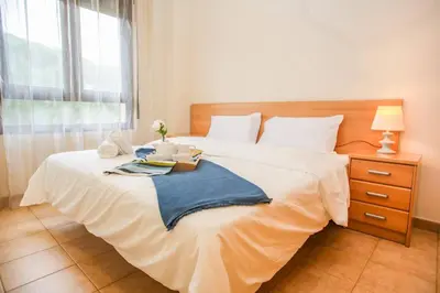 Cama o camas de una habitación en AL37 Precioso apartamento playa Fenals