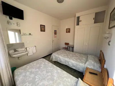 Cama o camas de una habitación en Hostal Zurich