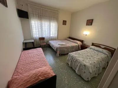 Cama o camas de una habitación en Hostal Zurich